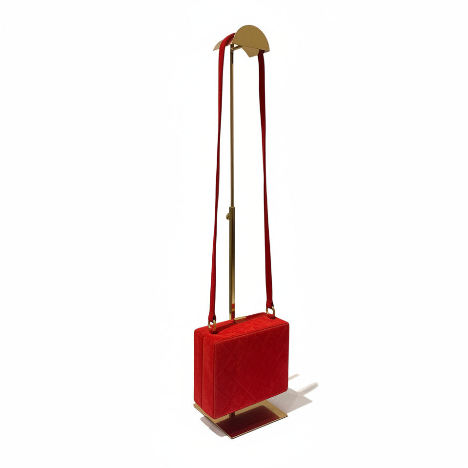 Red square bag with a strap on a white background
