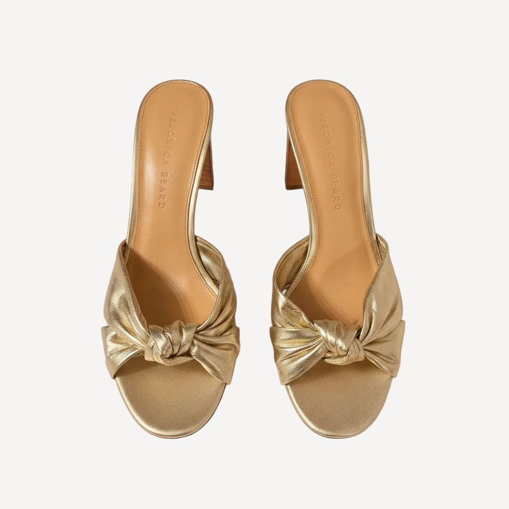 Bailey Grace Closet Concierge Veronica Beard metallic gold heeled mule sandals with a knotted strap detail.